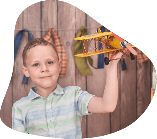 Child playing with toy plane.